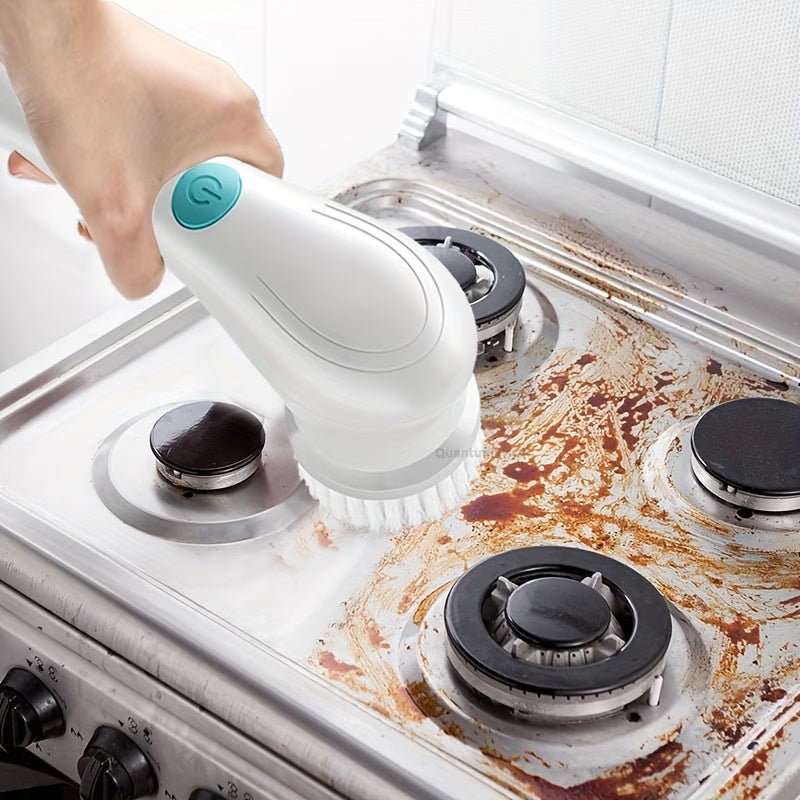 Electric Cleaning Brush being used on a stove with visible grime